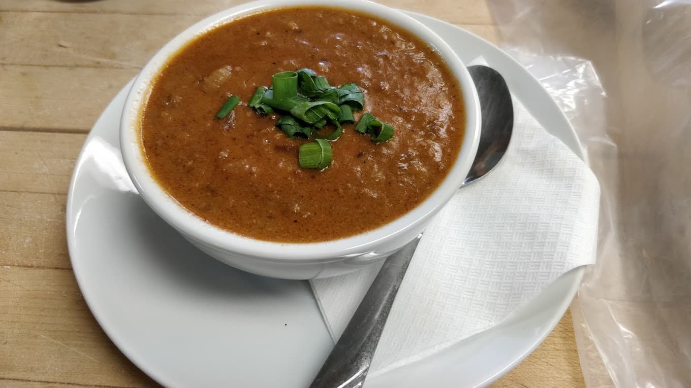 A bowl of the day's scratch-made soup topped with green onion